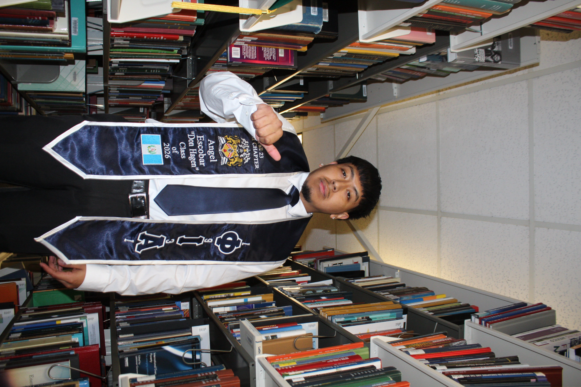 First-generation graduate portrait in the library