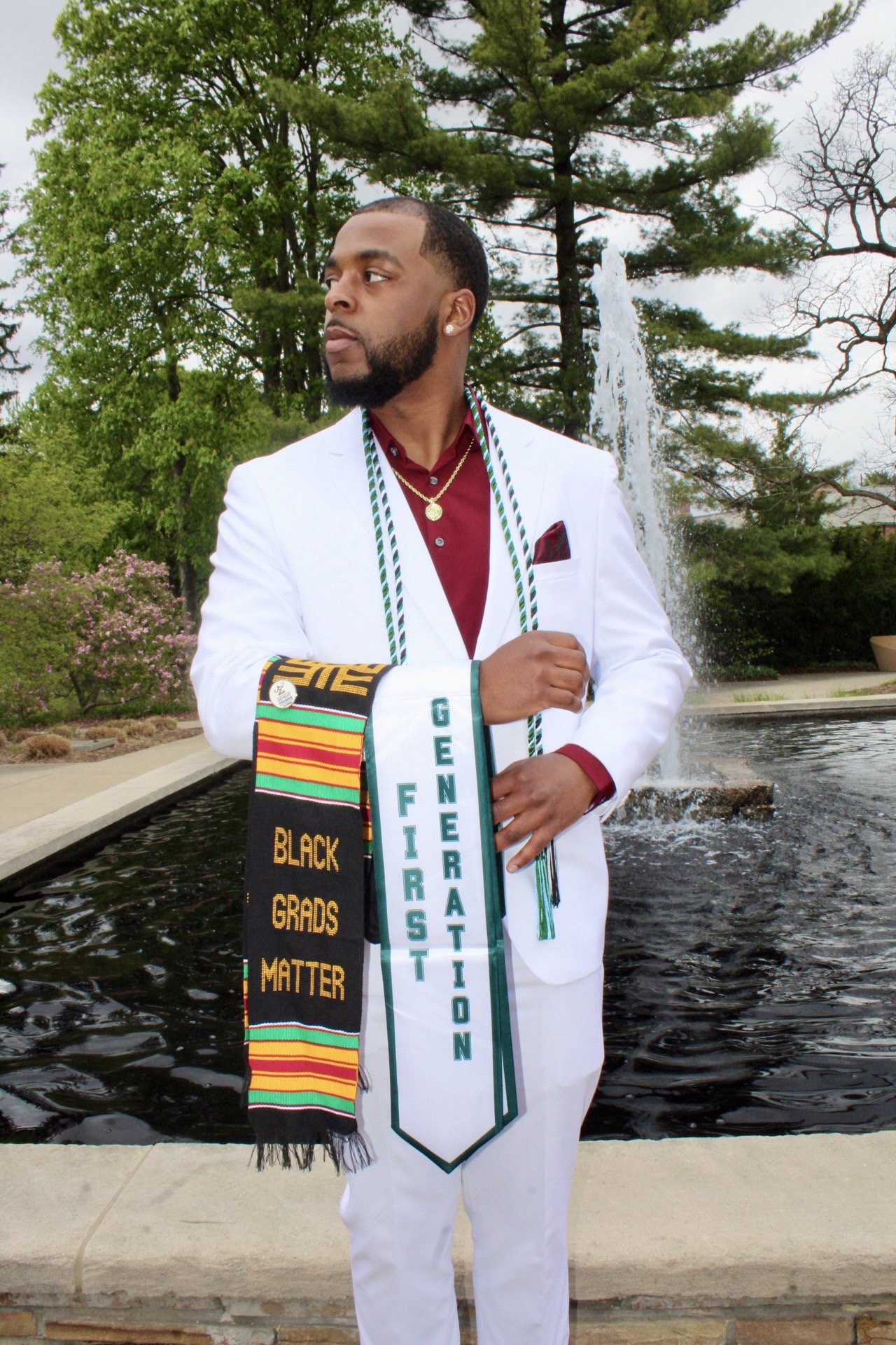 First-generation graduate wearing cultural graduation stoles